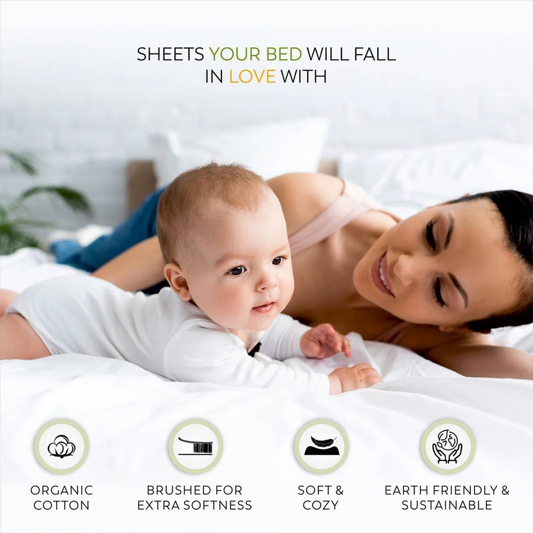 Woman and baby lying on a bed with text about organic cotton sheets.