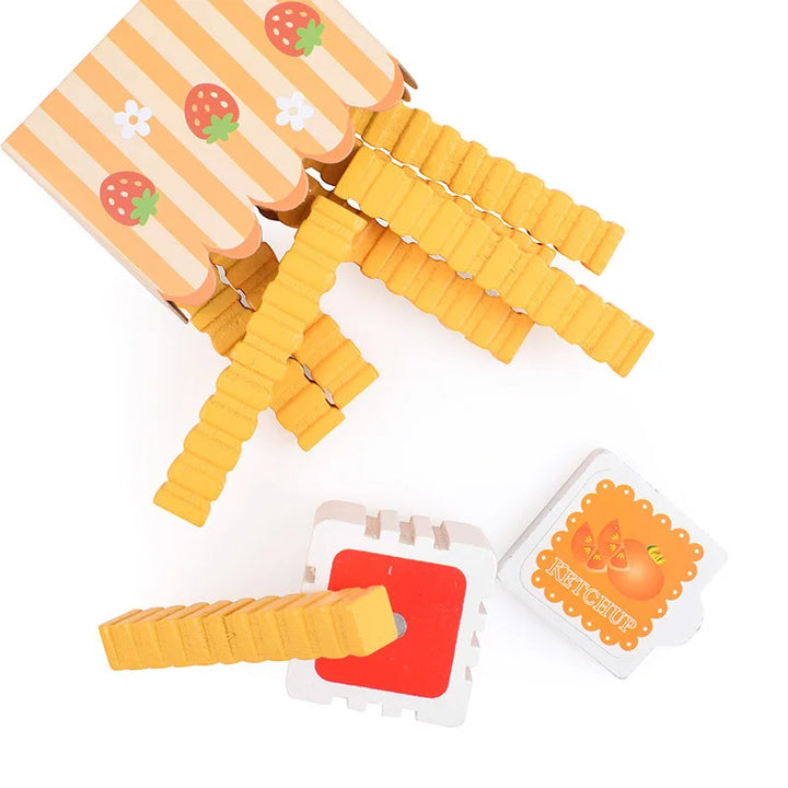 Yellow plastic clips with strawberry design on a white background.