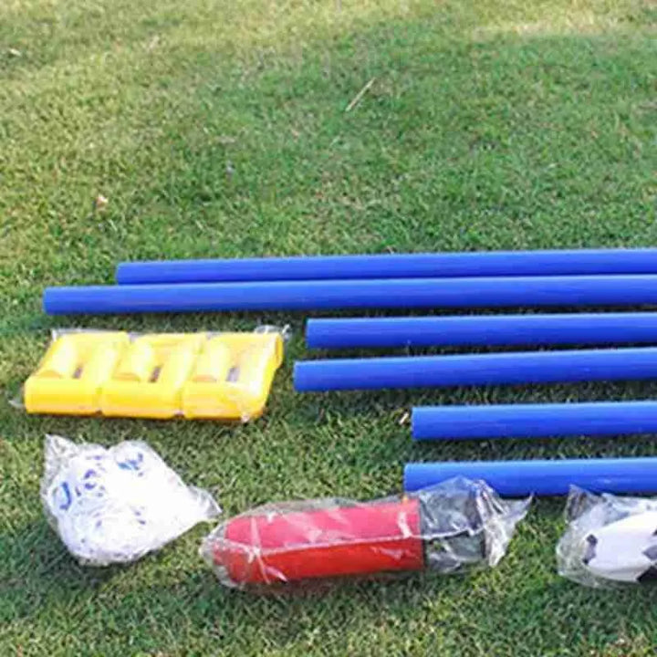 Blue poles and sports equipment on grass.