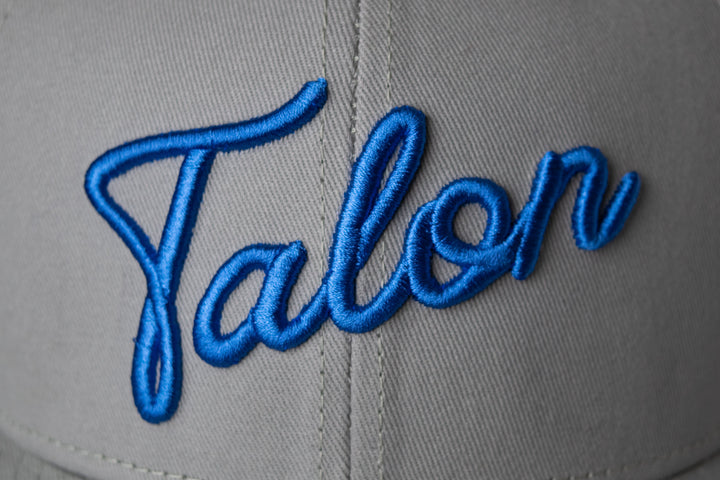 Flat Brim Hat Grey with Royal Script Closeup.