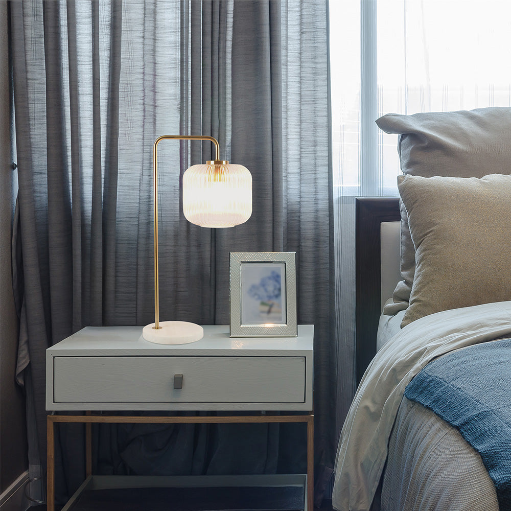 Haven Clear Glass Table Lamp, Gold Brush Metal and Marble Base, Button Control on Nightstand.