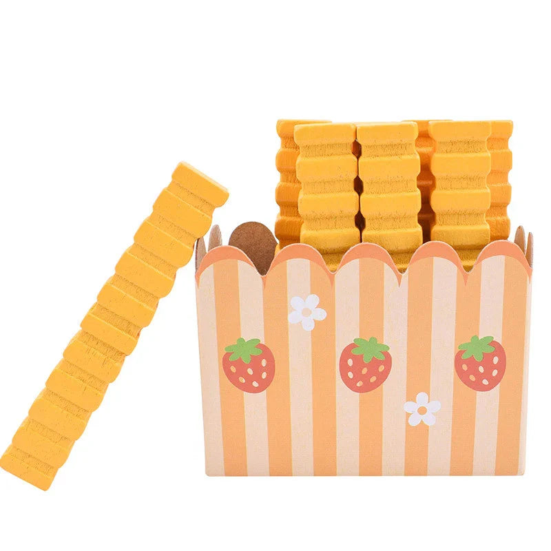 Yellow dog chew toy with a packaging box featuring strawberry and flower designs on a white background.