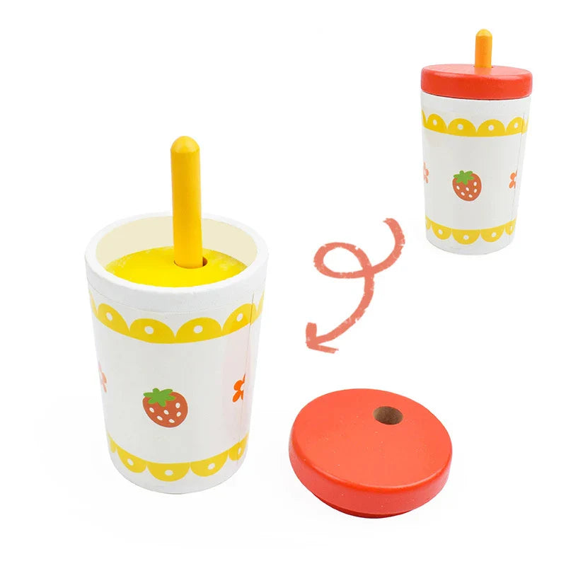 Children's toy cup with straw and lid on a white background.