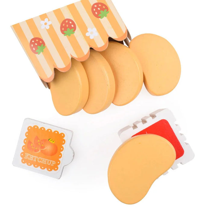 Set of yellow fruit-shaped toys with packaging on a white background.