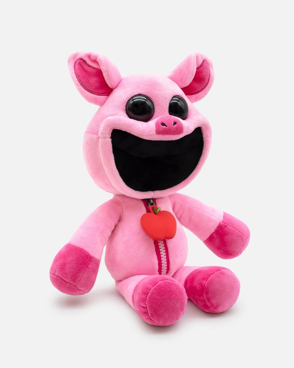 Pink plush toy with a black face and red heart on a white background.