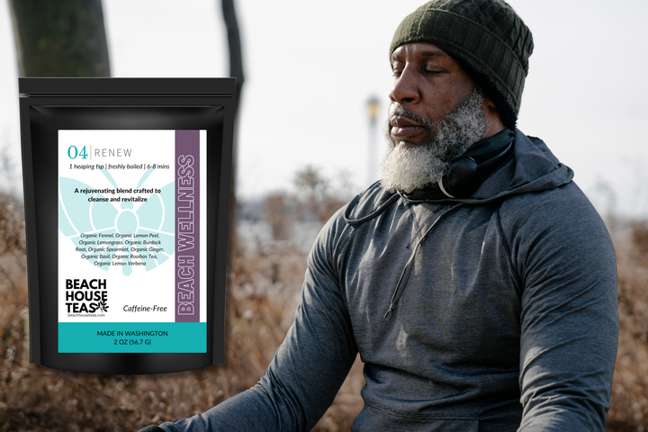 Man in outdoor setting with Beach House Teas package displayed.