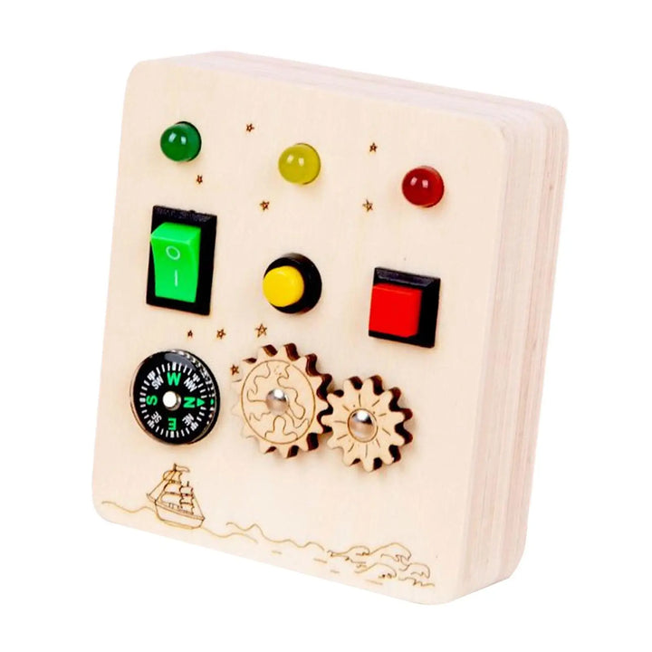 Wooden toy control panel with buttons and dials on a white background.