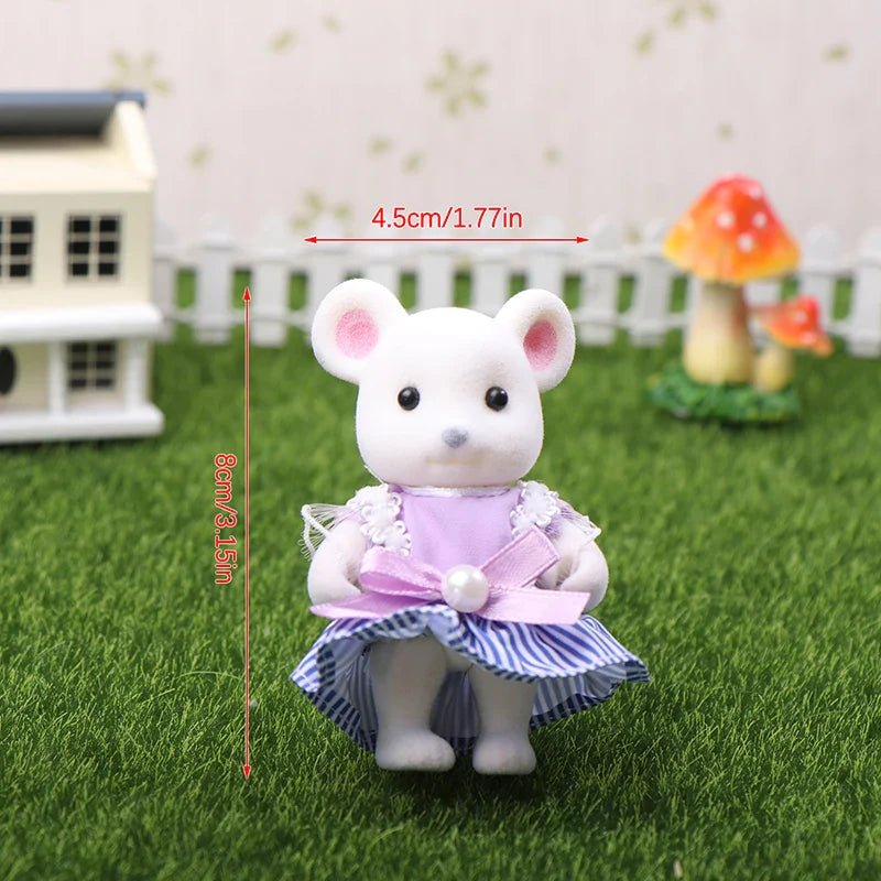 White mouse figurine with a purple dress on grass with measurements indicated.