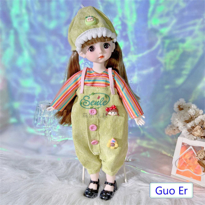 Doll wearing a colorful outfit with a striped shirt and green overalls, standing on a textured surface with a blurred background.