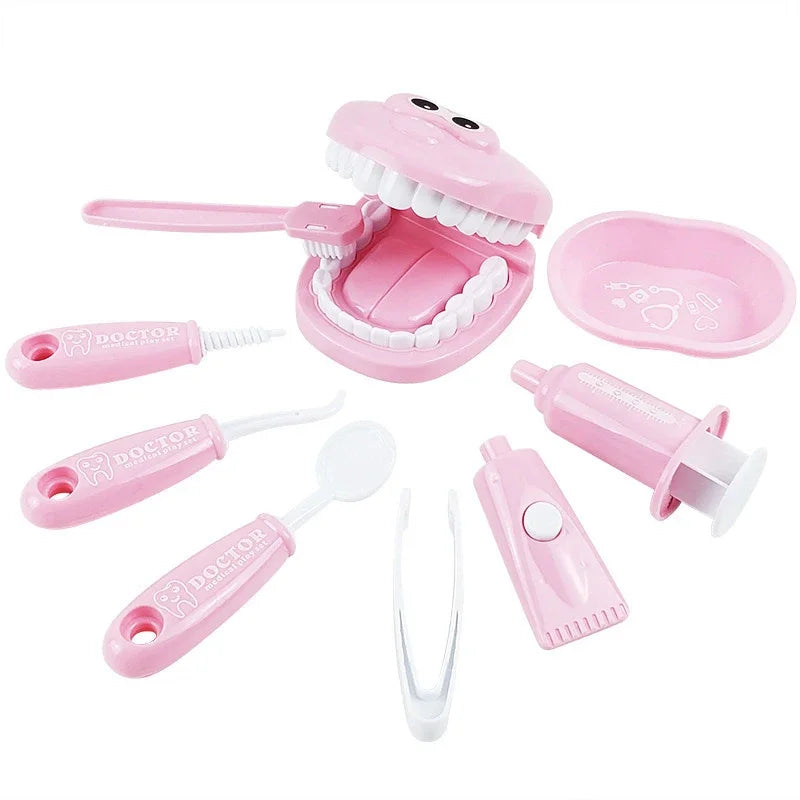 Pink dental toy set with various components on a white background.