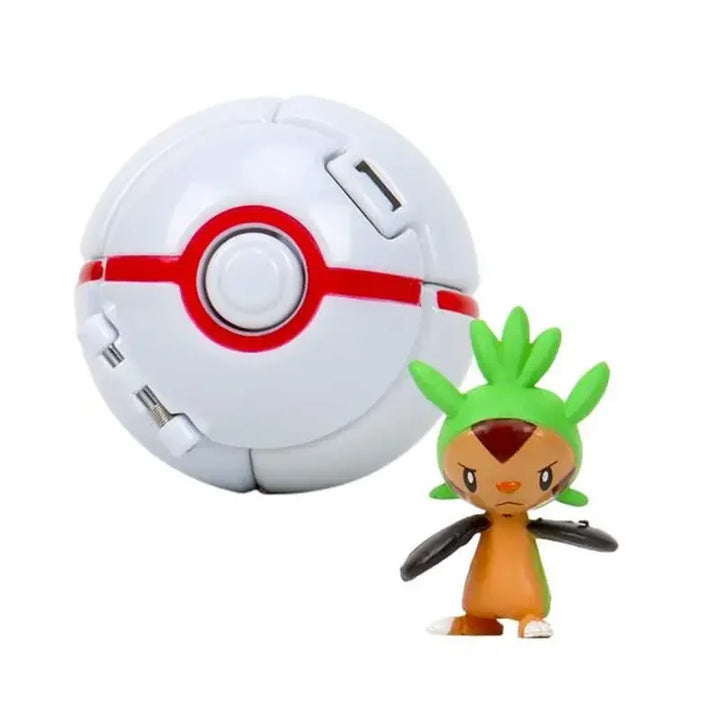 Poké Ball and a small figurine on a white background.