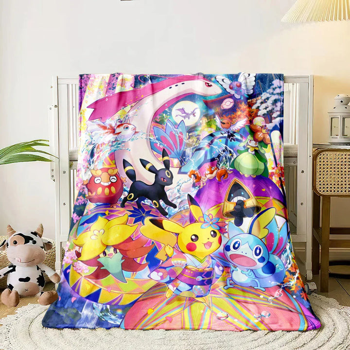 Colorful cartoon-themed blanket draped over a bed in a room with a plant and desk.