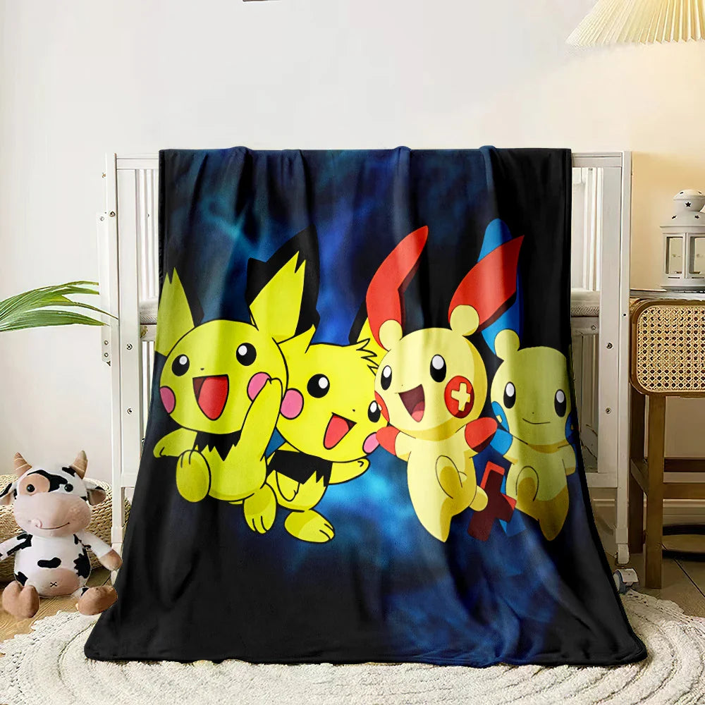 Blanket with cartoon characters on a bed in a room.