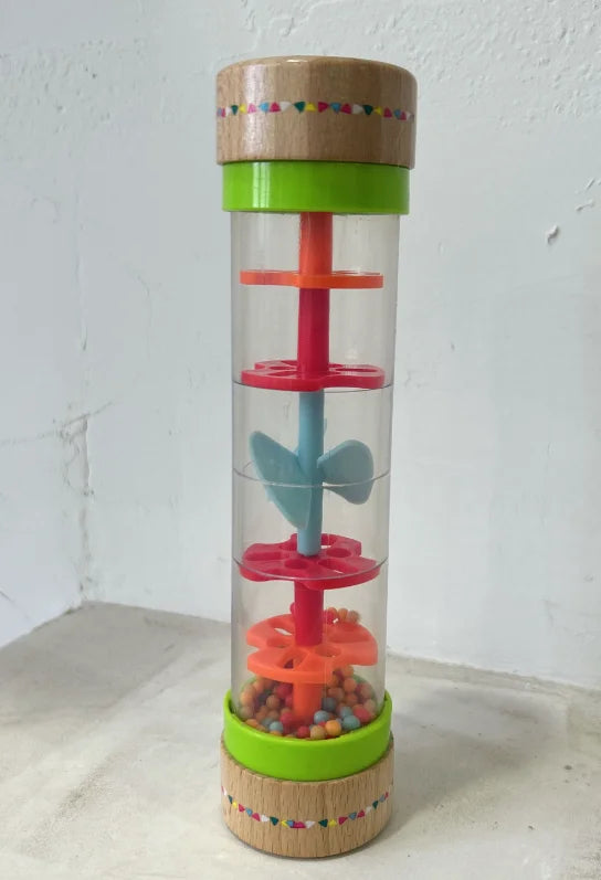 Colorful toy with a transparent middle section on a white background.