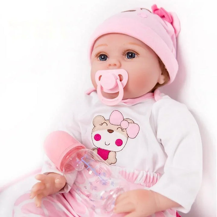 Baby doll with pink outfit and pacifier on a white background.
