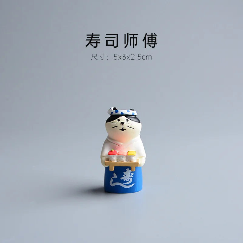 Small figurine of a cat character with a blue stand on a gray background.