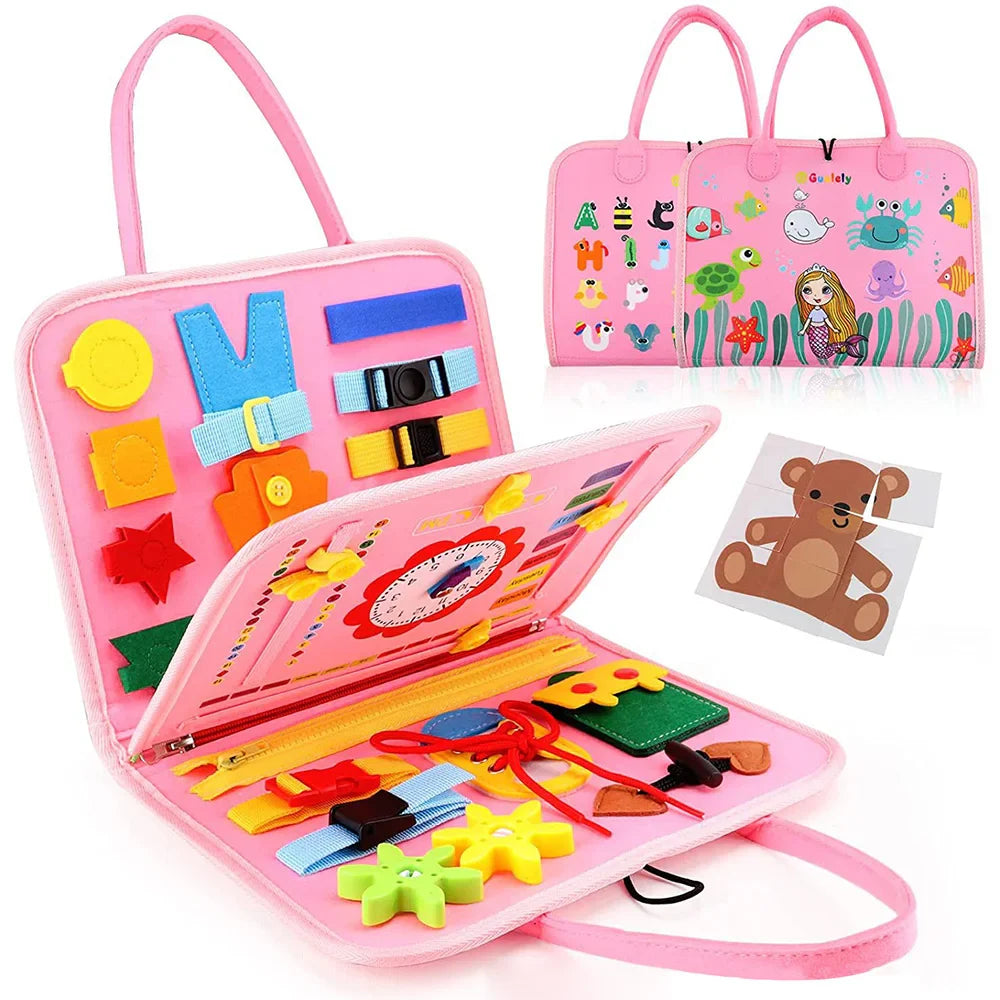 Pink educational toy set with various colorful items and a matching pink carrying case on a white background.