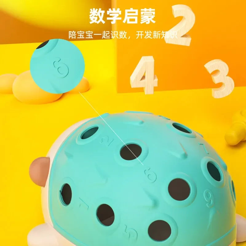 Teal educational toy with black dots on a yellow background with numbers.