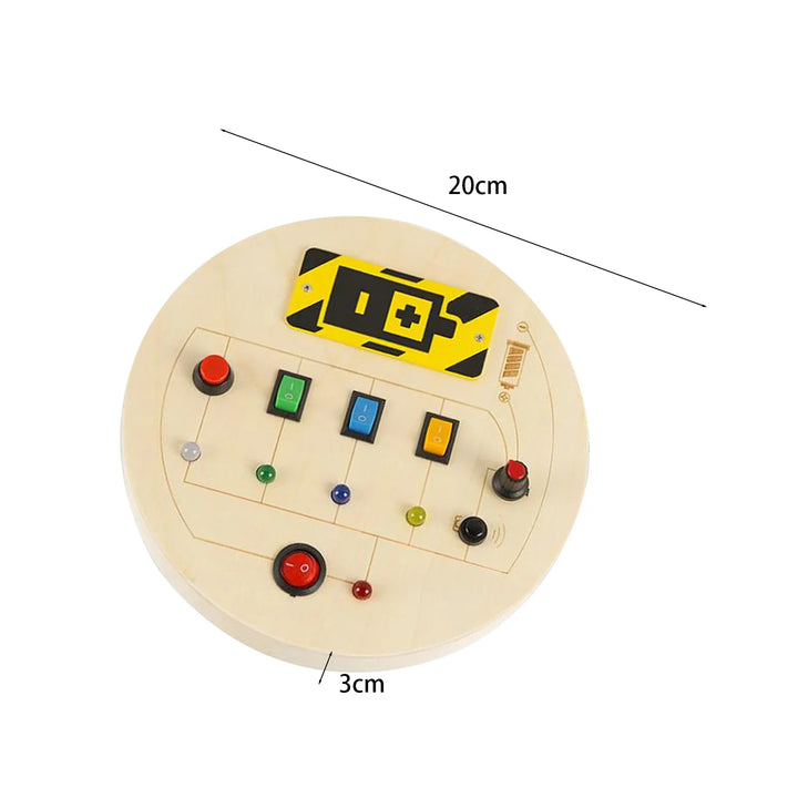 Round wooden board with colorful buttons and a yellow and black sign, labeled with dimensions.