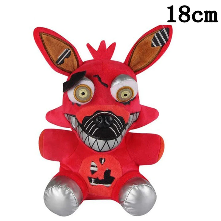 Red plush toy with a pumpkin design on a white background.