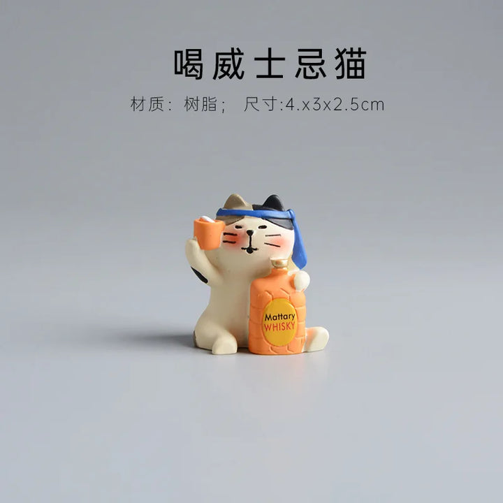 Cat figurine holding a bottle on a gray background.