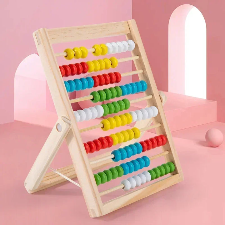 Colorful abacus on a pink background.