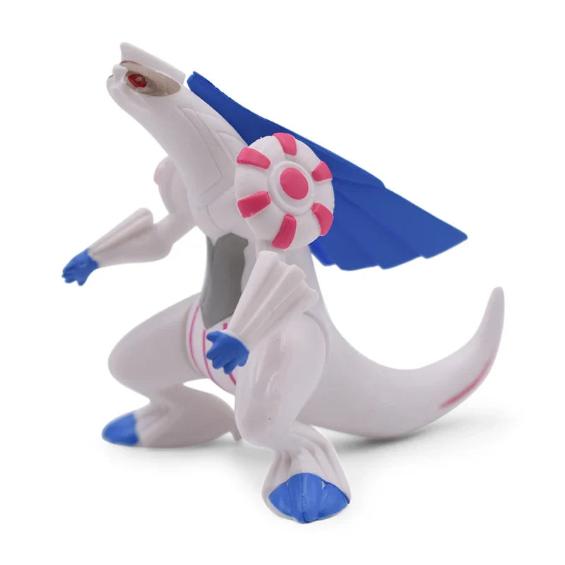 Toy figure of a white creature with blue and pink accents on a white background.