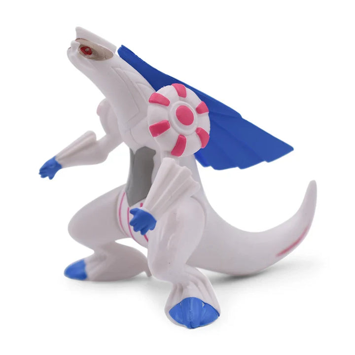 Toy figure of a white creature with blue and pink accents on a white background.