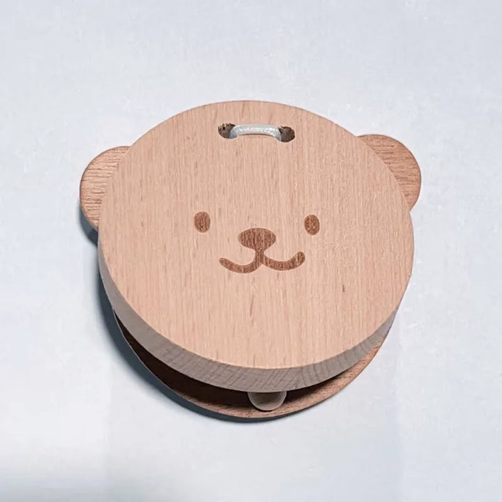 Wooden product with a bear face design on a white background.