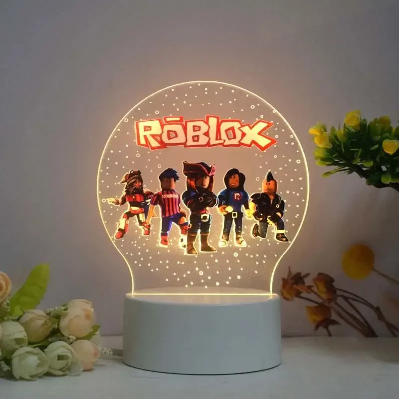 Roblox-themed night light with character illustrations on a white surface.