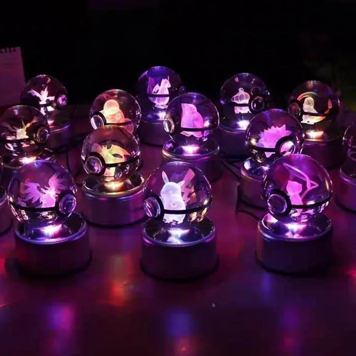 Set of crystal balls with embedded images on a dark background.
