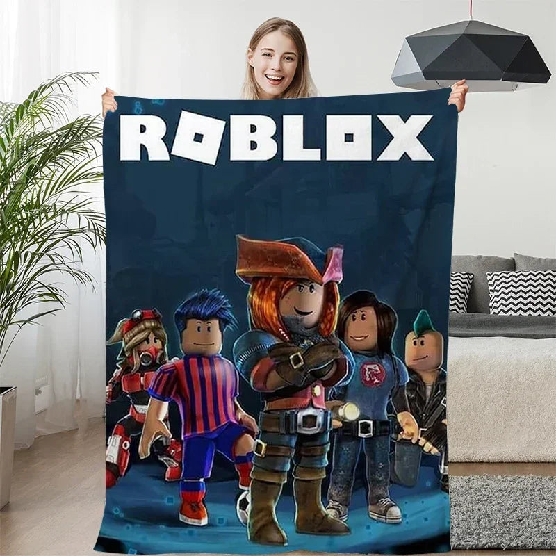 Person holding a Roblox-themed blanket with characters in a living room.