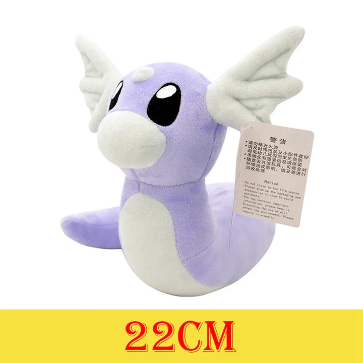 Purple and white plush toy with a tag on a white background.