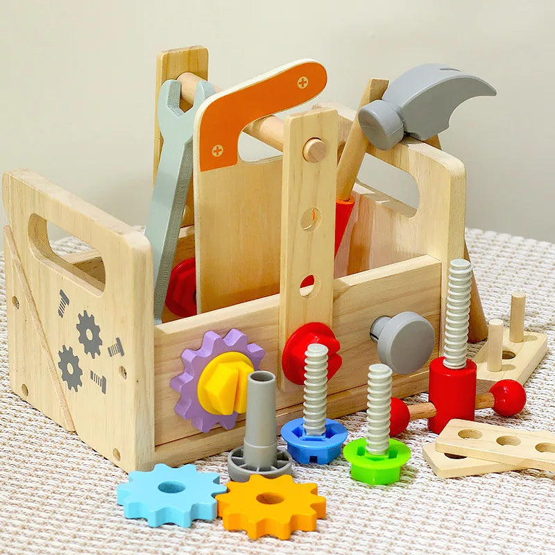Wooden toy toolbox with tools and gears on a textured surface.