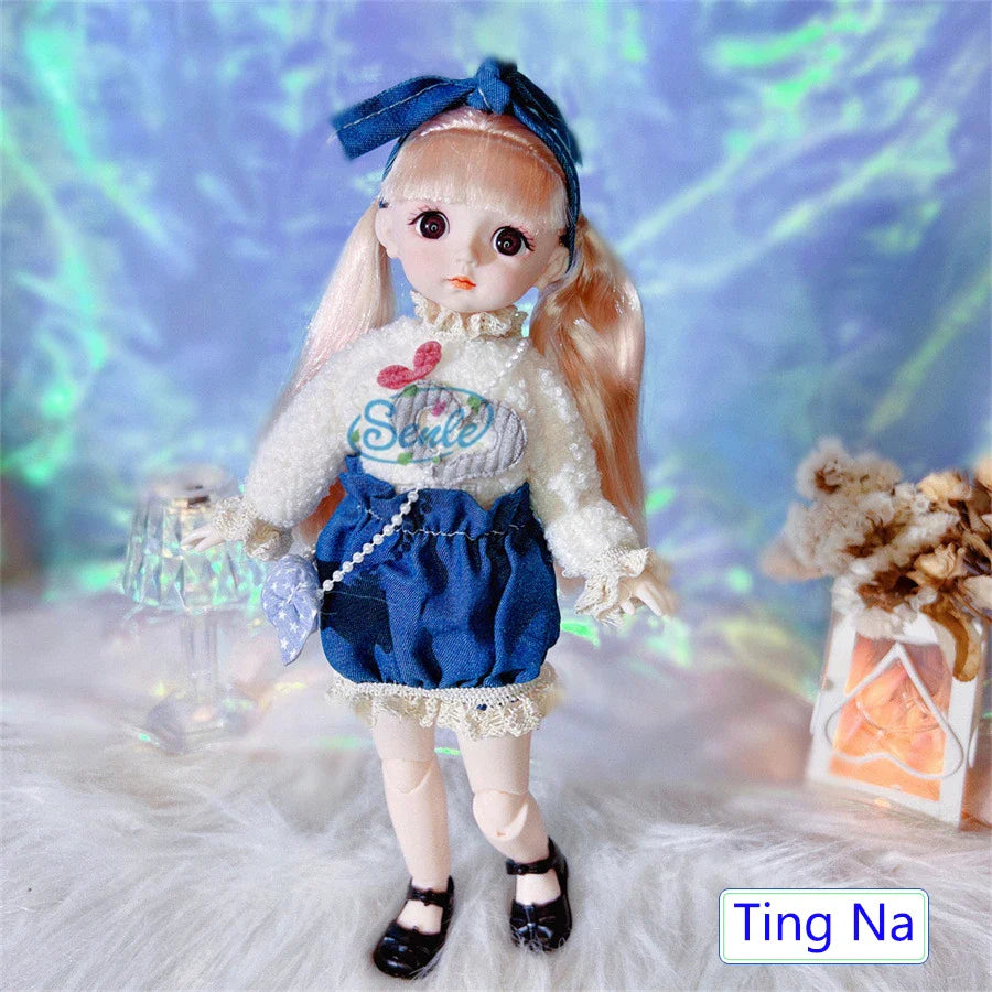 Doll with blue hair bow and white outfit with text, standing on a textured surface with decorative elements.