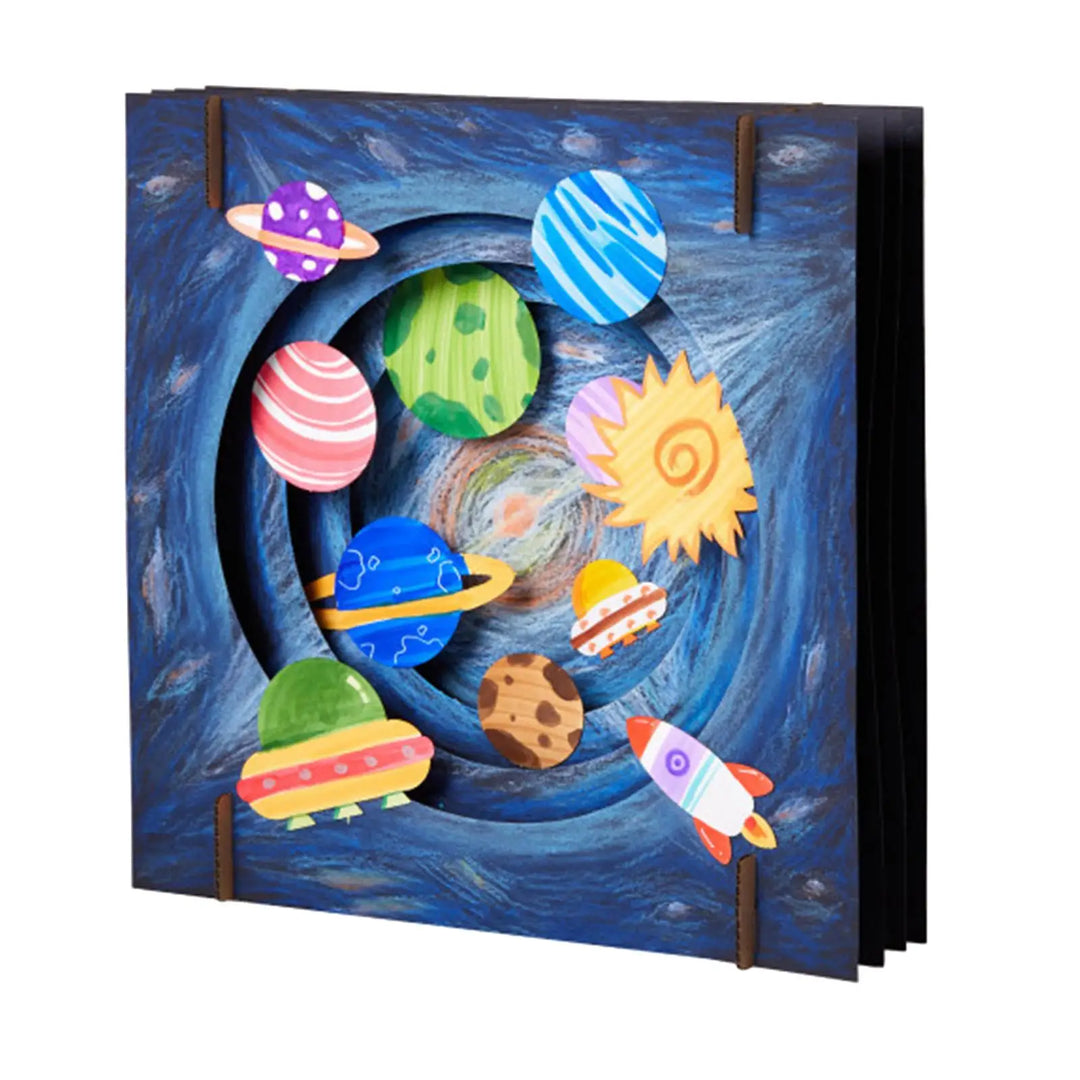 Colorful space-themed pop-up book with planets and rockets on a blue background.