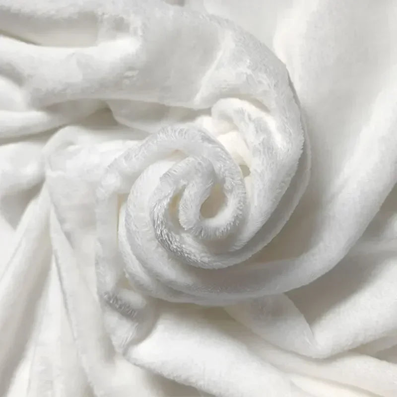 Close-up of white fabric with a soft texture.
