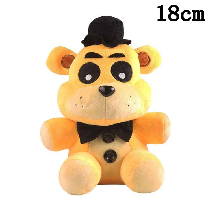 Plush toy bear with a top hat and bow tie on a white background.