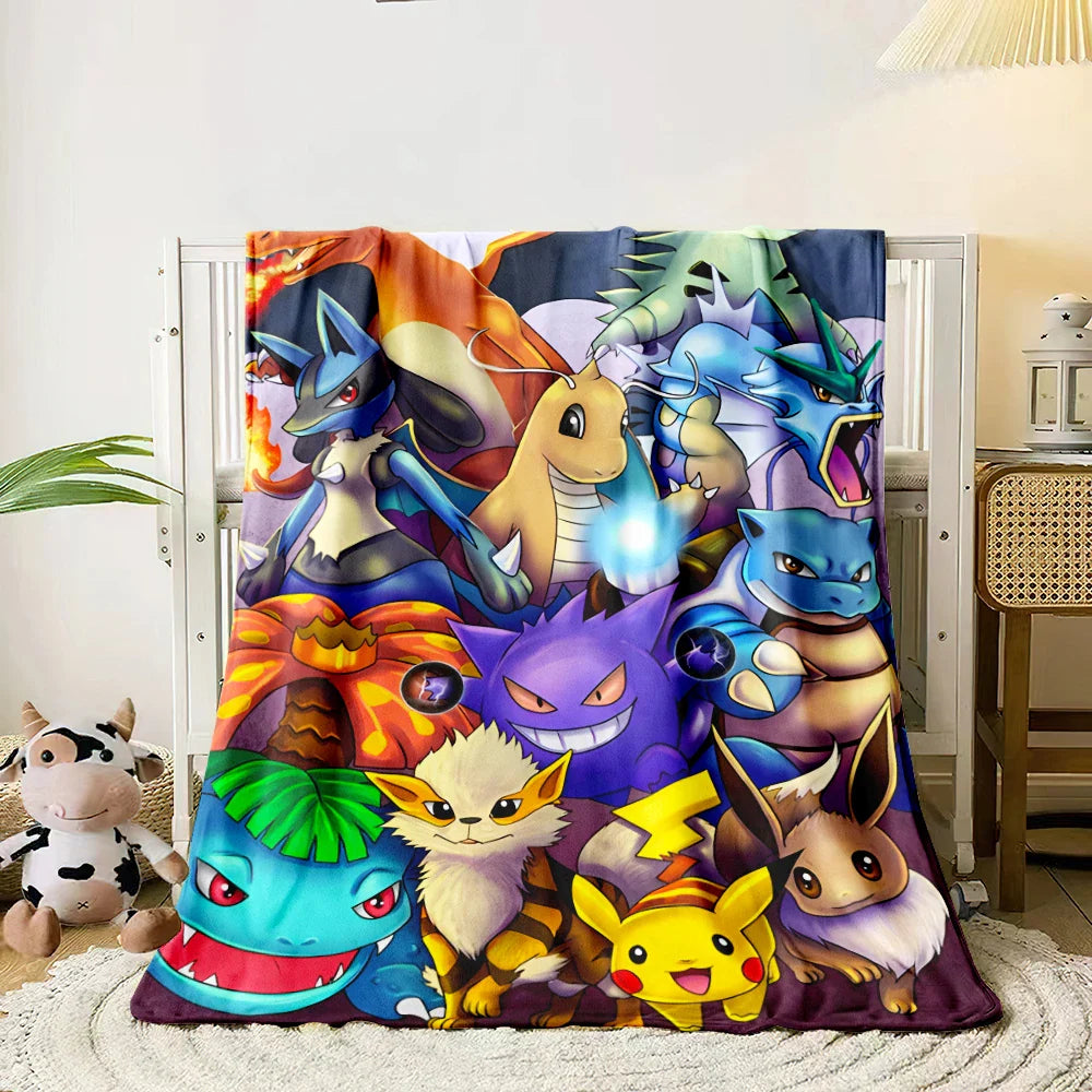 Colorful cartoon character blanket draped over a chair in a room with a plant and desk.