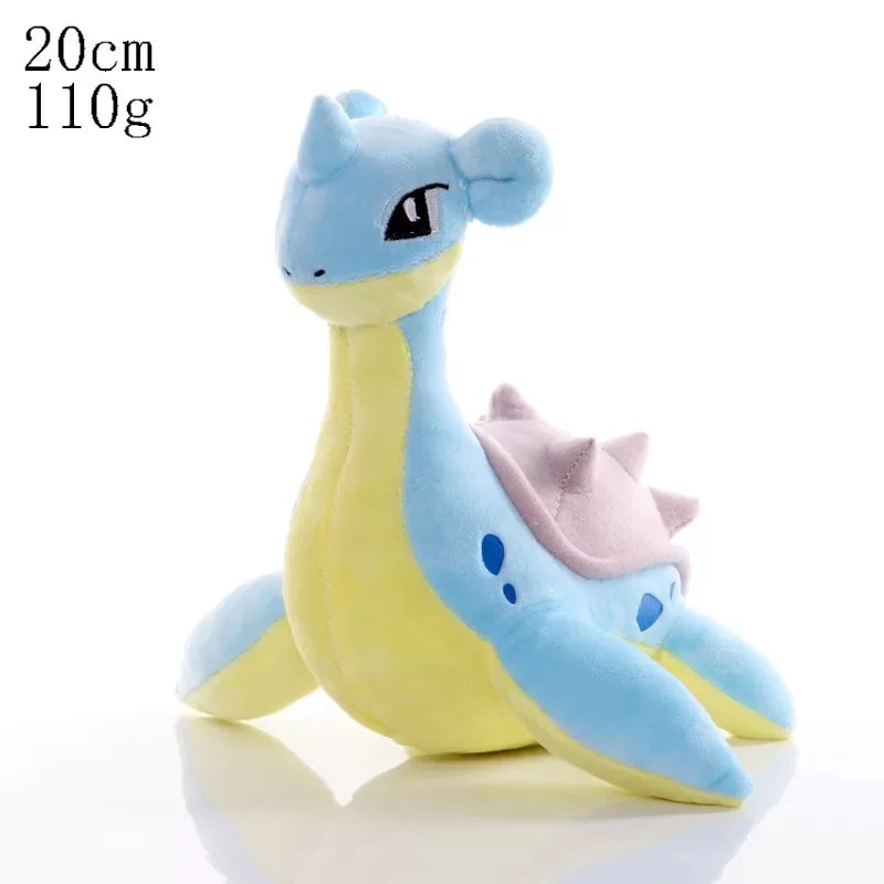 Plush toy resembling a dragon with blue and yellow colors on a white background.