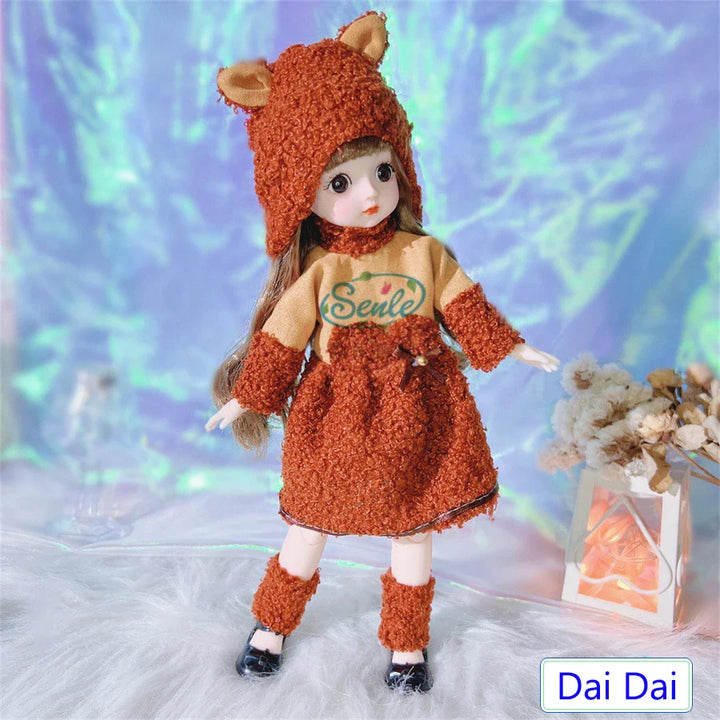 Doll in a fox-themed outfit with branding on a soft, blurred background.