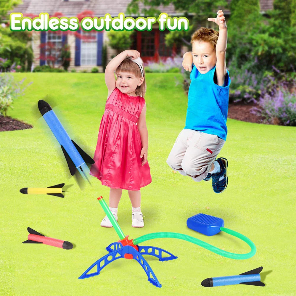 Children playing with toy rockets on a grassy lawn with text endless outdoor fun.