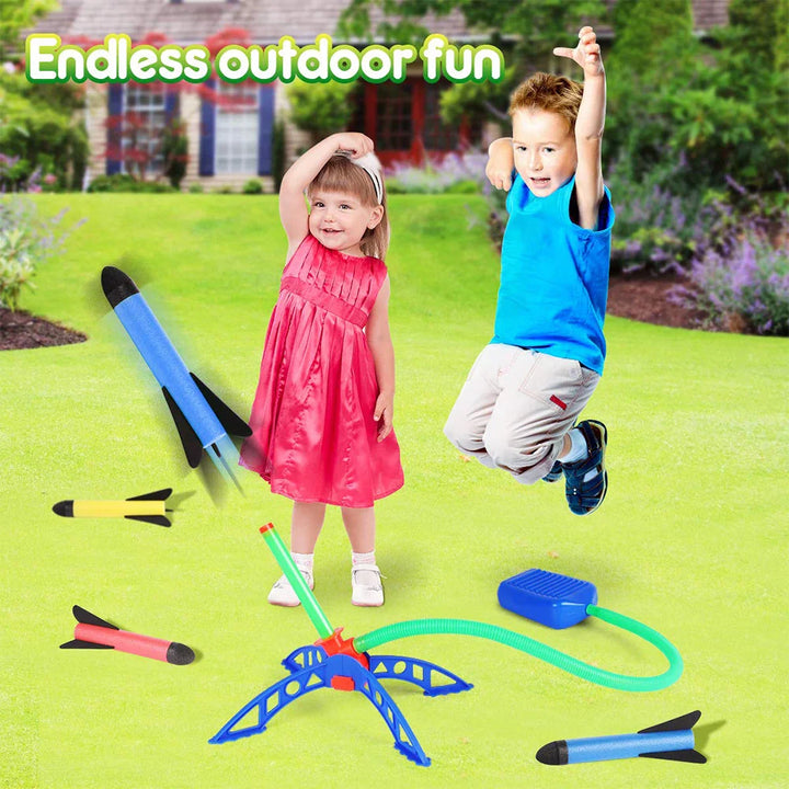 Children playing with toy rockets on a grassy lawn with text endless outdoor fun.