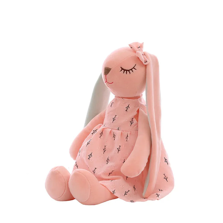 Pink plush toy with long ears on a white background