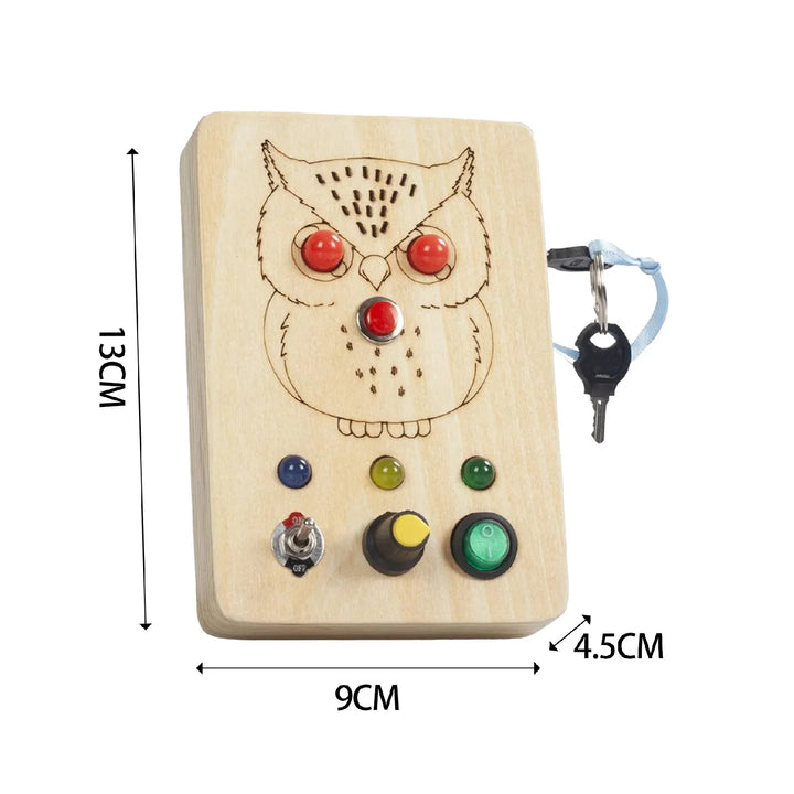Wooden owl-shaped device with buttons and keychain attachment, showing dimensions.