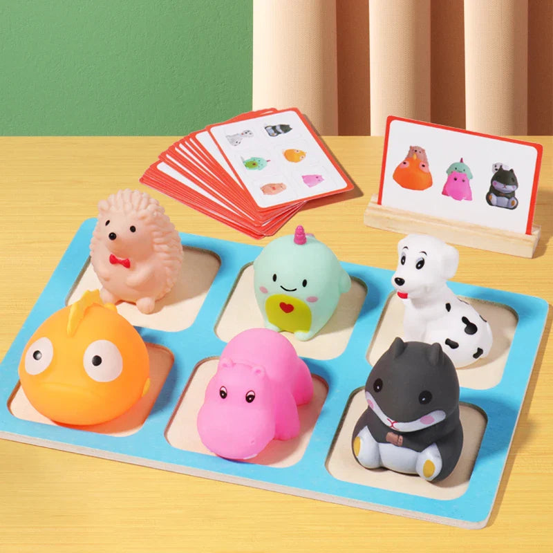 Set of colorful animal-shaped toys on a wooden board with matching cards in the background.