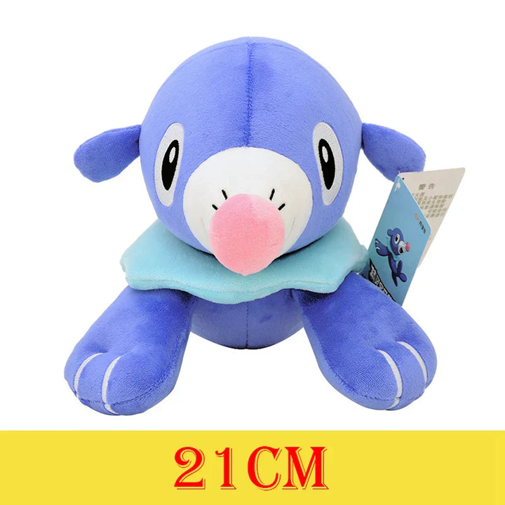 Blue plush toy with a pink nose on a white background.