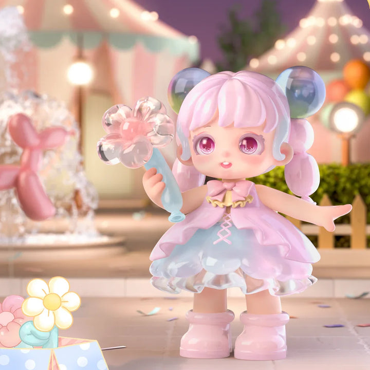 Toy figure with pink hair and dress in a festive setting.