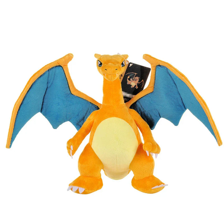 Plush toy of a dragon with blue wings on a white background.