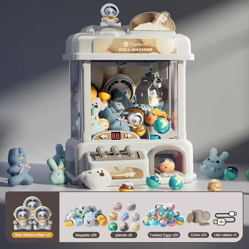 Toy claw machine with various toys and collectibles on a gray background.